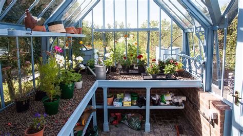 using metal racks in green house|greenhouse shelving ideas.